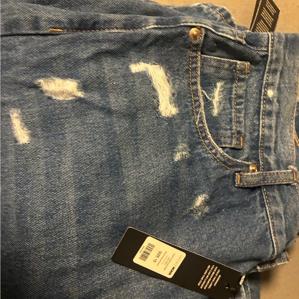 Distressed Blue Denim Jeans
